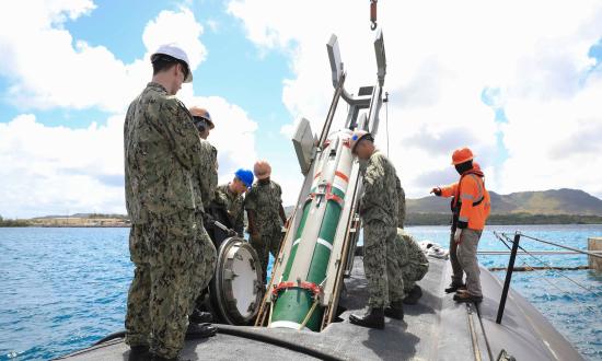 Sailors assigned to the Los Angeles–class fast-attack submarine USS Annapolis (SSN-760) load a Mk 67 submarine launched mobile mine in Agana, Guam