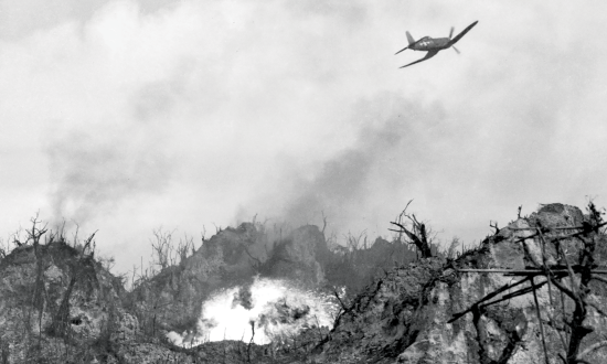 An F4U Corsair drops napalm during battle for Peleliu's Umurbrogol Mountain