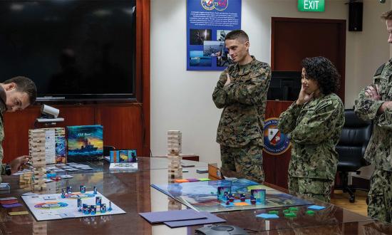 Sailors play an information warfare wargame centered on logistics and sustainment in the Indo-Pacific. The pilot wargame was led by the Center for Naval Analyses.