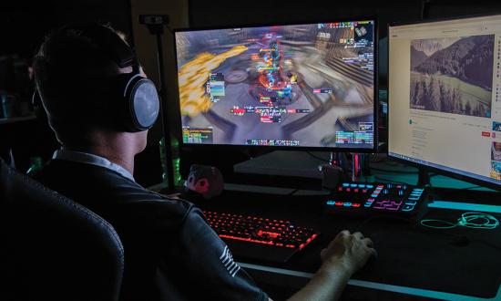 A U.S. Army eSports team member at a gaming rig at Fort Knox, Kentucky. Unlike traditional computer-based simulation and wargames, which rely heavily on preestablished scenarios, AI-embedded simulations could generate vignettes autonomously and produce numerous courses of action for given scenarios.