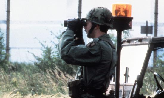 Members of the U.S. Army’s Berlin Brigade observe the Berlin Wall from the West German side. The U.S. Army occupied West Berlin from July 1945 to September 1994, steadfast through the Berlin Airlift, the Checkpoint Charlie Crisis, and Able Archer 83 debacle. 