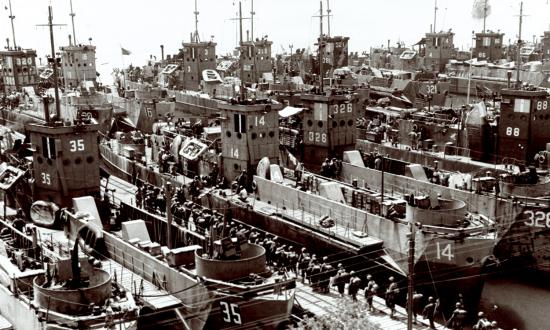 Allied troops loading into landing craft, infantry at a North African port in preparation for Operation Husky, the invasion of Sicily.