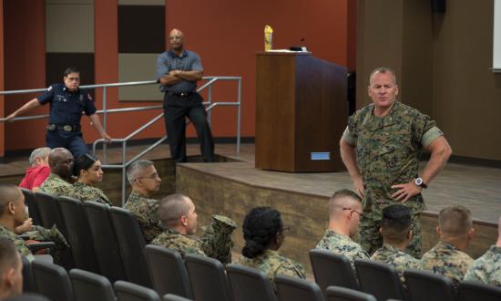 Col. Martin, USMC, conducting a safety standdown in an auditorium in 2017