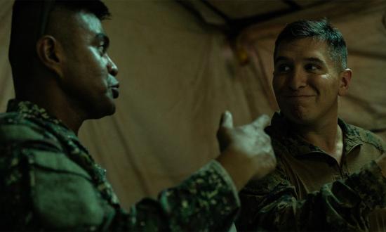 A Marine in the Philippine Marine Corps, left, and an an operations officer with 3d Littoral Logistics Battalion, 3d Marine Littoral Regiment, 3d Marine Division, discuss plans  for KAMANDAG 7, at Camp Cape Bojeador, Philippines, in November 2023. In small working groups and planning teams, collegial leadership is essential to sharing ideas—especially when working with joint forces, allies, and partners.