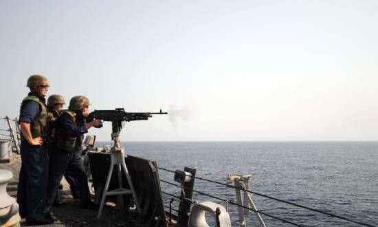 A chief petty officer and ensign observe a weapons exercise on board the Mitscher (DDG-57)