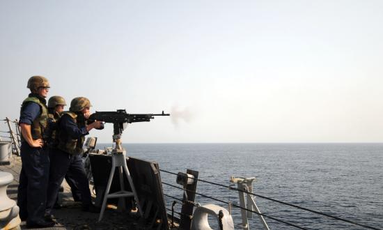 A chief petty officer and ensign observe a weapons exercise on board the Mitscher (DDG-57)