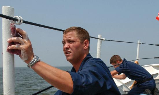 Cuttermen scrub down the cutter Bainbridge Island (WPB-1343)