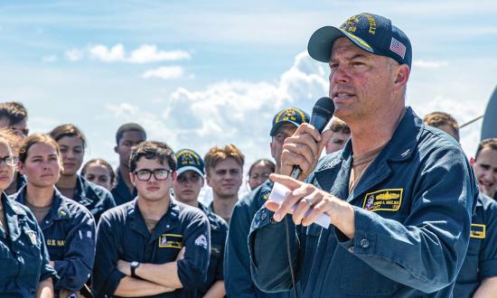 A commanding officer speaks to his crew during an all-hands meeting