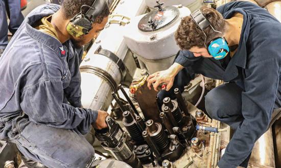 Enginemen conduct maintenance on board the dock landing ship USS Carter Hall (LSD-50). Navy leaders have to consider key decisions, such as when to share the workload among multiple departments, to meet evaluation dates and other deadlines.