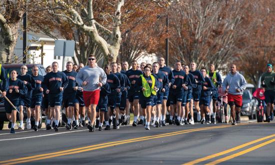 Coast Guard recruits going through basic training participate in an off-base run. Leaders may strive to finish first, but they must not outpace their crews.