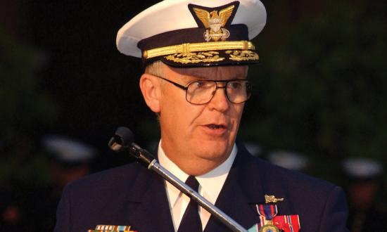 Admiral James Loy speaking at a podium