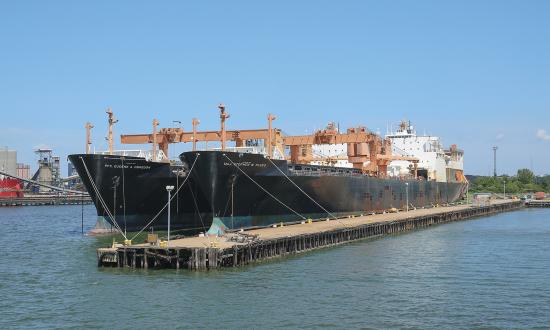 A view of Military Sealift Command's container, roll-on/roll-off ships USNS PFC Eugene A. Obregon (T-AK 3006) and USNS Maj Stephen W. Pless (T-AK 3007) pier-side,