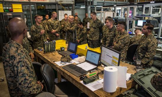 Marine students at the Expeditionary Warfare School tour a maintenance facility in Camp Pendleton, California.