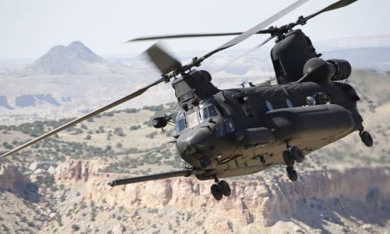 An Army MH-47 Chinook flies over Afghanistan.