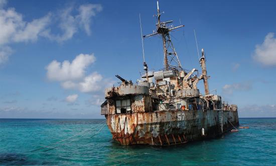 A troop of Philippine Marines permanently lives on board the Sierra Madre, a World War II–era tank landing ship intentionally grounded on the Second Thomas Shoal, inset, in 1999 to bolster the island nation’s claim to the South China Sea territory.