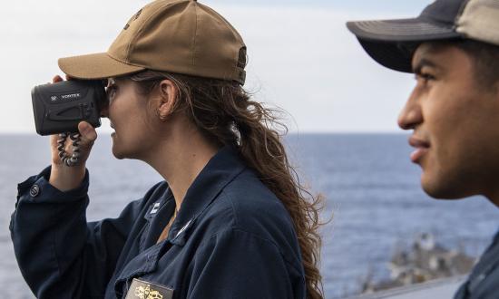 Sailors stand watch on the USS Dewey (DDG-105).
