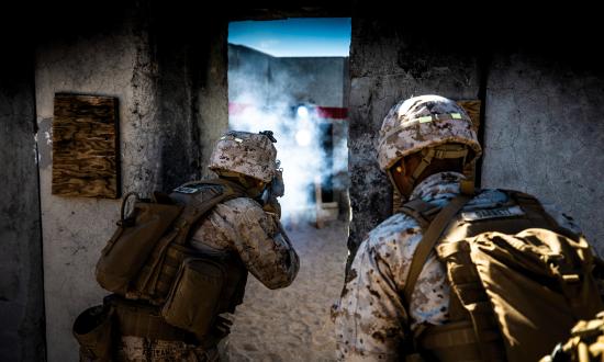 Marines from 1st Battalion, 7th Marine Regiment, clear a building at the Twentynine Palms Military Operations on Urban Terrain (MOUT) Center.  Such facilities can be better for training than operational testing, because restricted military training grounds lack robust civilian populations or major urban centers and are not representative information environments.