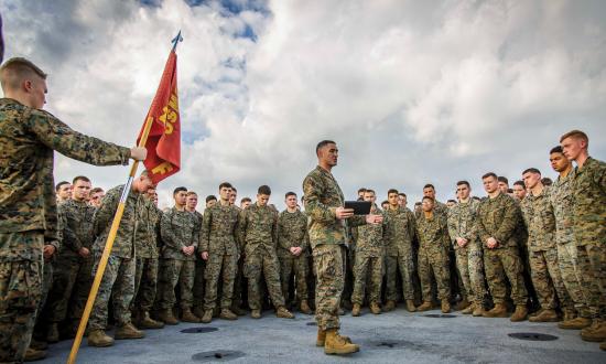 U.S. Marine Corps Capt. Joseph Murphy, center, commanding officer of Fox Company, Battalion Landing Team, 2nd Battalion, 6th Marine Regiment, 26th Marine Expeditionary Unit (MEU) and commander of troops aboard the dock landing ship USS Oak Hill (LSD 51), addresses Marines after a promotion ceremony aboard the Oak Hill in the Atlantic Ocean, Dec. 1, 2017