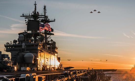 Marine Corps aircraft fly over the USS Kearsarge (LHD-3) in the Baltic Sea