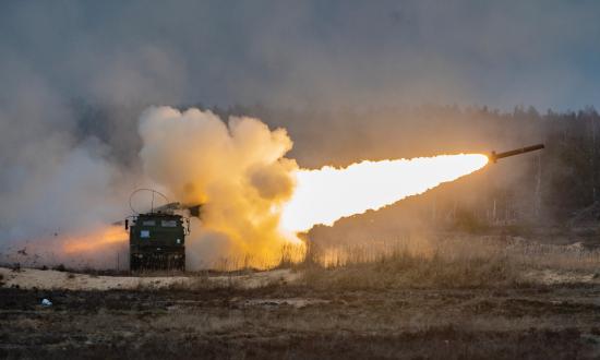 U. S. Marines with Fox Battery, 2nd Battalion, 14th Marine Regiment, 4th Marine Division, launch rockets from a High Mobility Artillery Rocket System during live-fire training at Adazi Training Area, Latvia