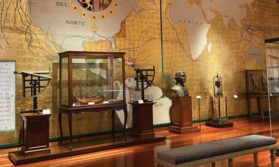 A gallery in the Museo Naval with a mural depicting Spanish voyages of discovery.