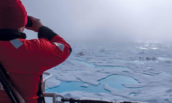 (Left) A crew member on board the USCGC Healy (WAGB-20) stands bear watch during an Arctic research mission  in the Beaufort Sea. The Coast Guard  could enhance its maritime awareness—while safeguarding the Arctic’s ecosystems and cultures—by integrating indigenous knowledge into its operations.