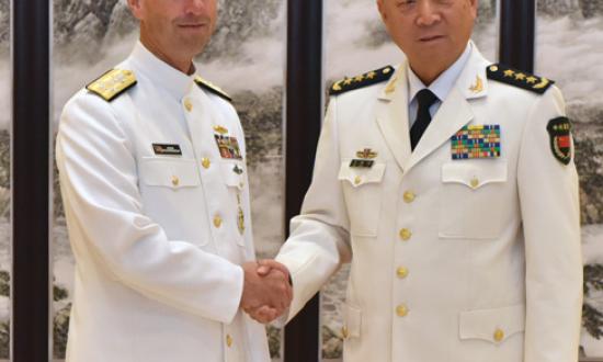 CNO Admiral John Richardson (left) shakes hands with Admiral Wu Shengli, Commander of the PLAN, at Chinese Navy Headquarters in Beijing during a July visit—just five days after the Permanent Court of Arbitration ruled against China in a South China Sea island territorial dispute. What signals do such engagements send to longtime U.S. allies?