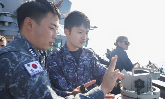 Sailors from the Republic of Korea Navy and Japan Maritime Self-Defense Force tour the USS Benfold (DDG-65) during a trilateral antisubmarine warfare exercise. Closer cooperation between Japan and South Korea would benefit both countries’ national security.