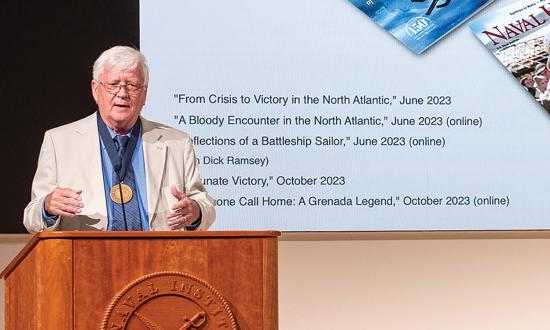Ed Offley addresses the audience at the U.S. Naval Institute’s Annual Meeting after receiving the Naval History Author of the  Year medal.