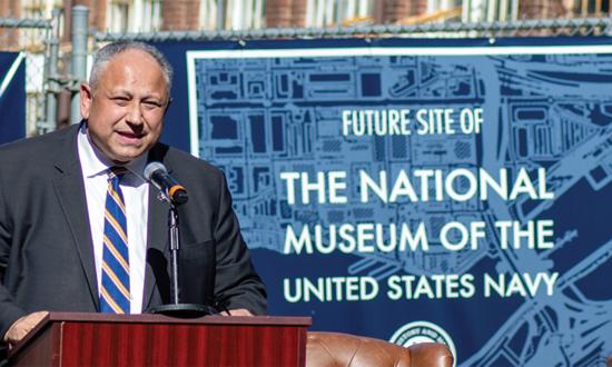 Secretary of the Navy Carlos Del Toro speaks to audience members during a ceremony for the new National Museum of the United States Navy in Washington, D.C.