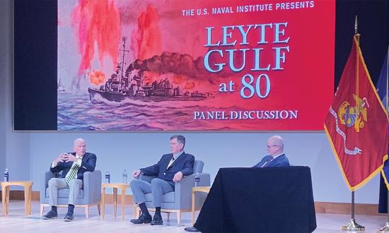Left to right: Panel moderator Alex Pocklington (aka Drachininfel), Thomas J. Cutler, Paul Stillwell, and Trent Hone take a deep dive into the greatest naval battle in history during a commemorative event at the Jack C. Taylor Conference Center in Annapolis, Maryland. 