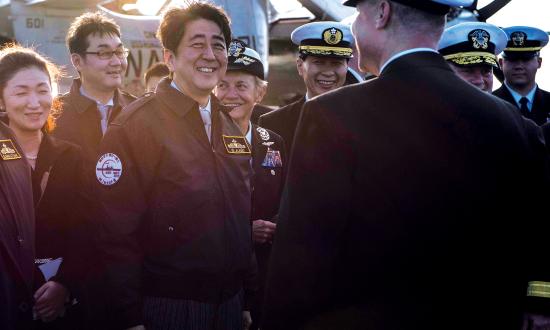 As prime minister of Japan, Shinzo Abe—here, on the carrier USS Ronald Reagan (CVN-76)—was an important U.S. ally, but his connection to the American people began four decades prior, as a student at the University of Southern California.