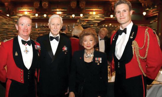 Captain Sally McElwreath and her husband, Rear Admiral Joe Callo—flanked by Major General Matt Holmes, Commandant General Royal Marines, left, and his aide, Captain Henry Townend—at the New York City Pickle Night Dinner in 2019. Started by the Callos 16 years ago, this annual dinner commemorates Admiral Lord Nelson’s victory at the Battle of Trafalgar and HMS Pickle, the smallest vessel in the 1805 battle.
