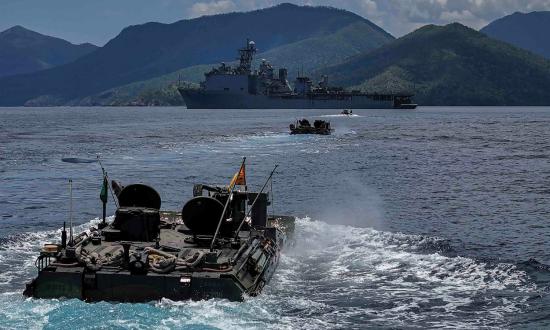 U.S. Marine Corps ACVs from Battalion Landing Team 1/5, 15th Marine Expeditionary Unit, return to the amphibious dock landing ship USS Harpers Ferry (LSD-49) during Exercise Balikatan 2024. 