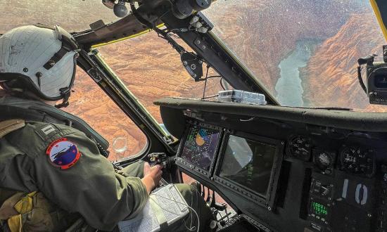 Lieutenant Claire Thatcher, an aviator from the Merlins of Helicopter Sea Combat Squadron 3, flies her MH-60S Seahawk/Knighthawk over the Grand Canyon in April 2024.