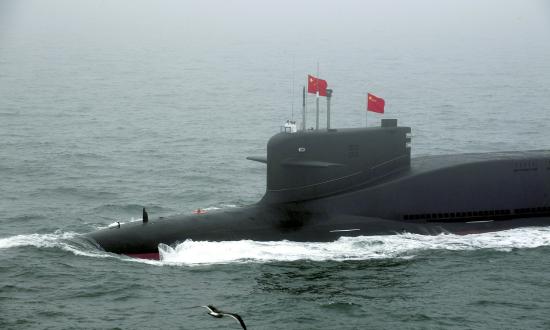 A new type of nuclear submarine of the Chinese People's Liberation Army (PLA) Navy is reviewed during a naval parade