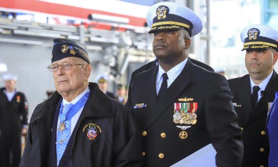 The USS Hershel “Woody” Williams (ESB-4) bears the name of the last surviving Medal of Honor recipient from the Battle of Iwo Jima. Chief Warrant Officer Williams is shown at the commissioning with Commander Samuel Hoard Jr., the ship’s officer-in-charge, gold crew, at the public ceremony in March.