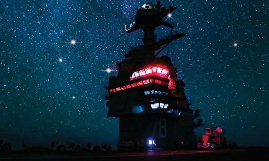 The superstructure of the USS Gerald R. Ford (CVN-78) as seen on a cloudless night in the Atlantic Ocean.