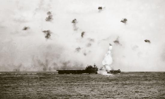 A kamikaze slams into the USS Enterprise off Okinawa.