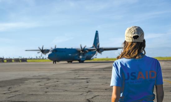  A USAID worker waits for a flight on a C-130J Hercules in Beira, Mozambique, April 3, 2019