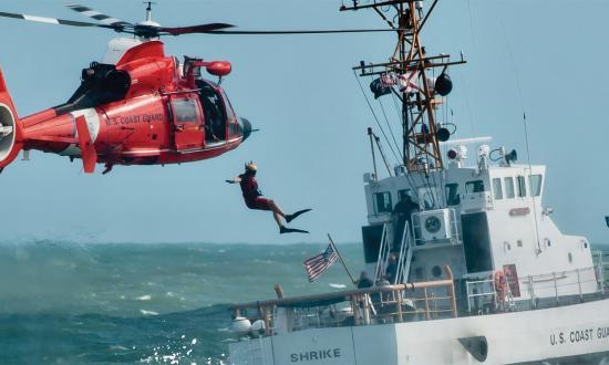 A Coast Guard rescue swimmer leaps into the ocean astern of the Marine Protector-class patrol boat USCGC Shrike (WPB-87342). All Coast Guard operations will benefit from the improvements needed to complete the service’s technological revolution.
