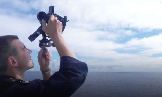 A Chilean midshipman uses a sextant to navigate on board the CNS Esmeralda