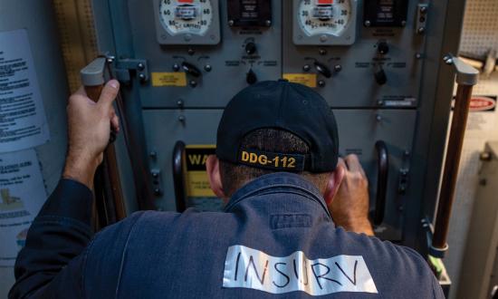 The degaussing switchboard in the central control station on board the Arleigh Burke–class guided-missile destroyer USS Michael Murphy (DDG-112) being inspected in 2019. The new Board of Inspection and Survey (InSurv) inspection takes two days and checks approximately 100 fewer pieces of equipment on an Arleigh Burke–class destroyer.