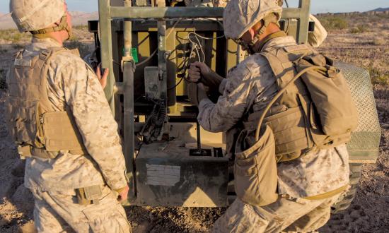 Marine Corps combat engineers prepare a line charge at Marine Corps Air-Ground Combat Training Center, Twentynine Palms, California. To best fight a peer enemy, Marine Corps combat engineers must be with the infantry—no lower than at the infantry regiment level and no smaller than as a reinforced engineer company.