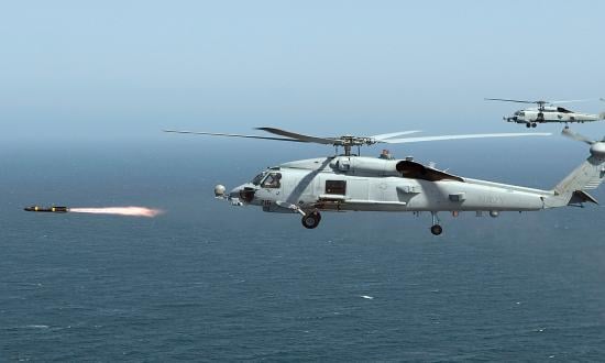 An MH-60R Seahawk assigned to Helicopter Maritime Strike Squadron 71 fires the first of four live AGM-114 Hellfire missiles. Amphibious Ready Group and Marine Expeditionary Unit leaders often do not account for the full warfighting capabilities of Helicopter Sea Combat detachments on board large-deck amphibious ships when planning operations.