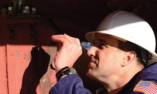 A marine inspector for Coast Guard Marine Safety Unit Portland, Oregon, inspects the propeller and rudder of the vessel Four Seasons. A data-driven marine inspection process would put the Coast Guard’s workforce in a better position to ensure the safe operation of the Marine Transportation System.