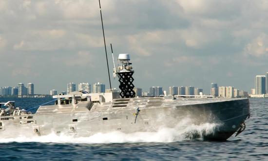 The Textron Systems Common Unmanned Surface Vehicle (CUSV), shown here, can be used for mine sweeping and neutralization. At approximately 12 meters long, the CUSV would benefit from a new “green over red” light scheme to warn civilian mariners in its operating area.