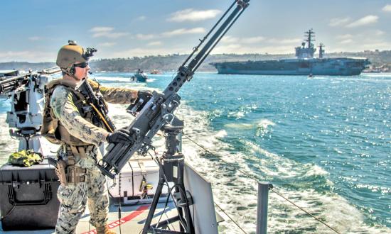 Squadron 3 mans an M2A1 .50-caliber machine gun