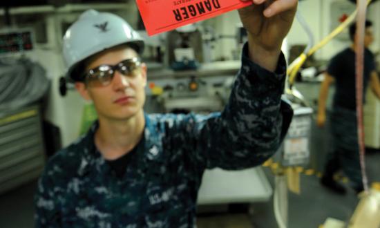 A machinist mate third class conducts a tagout audit.