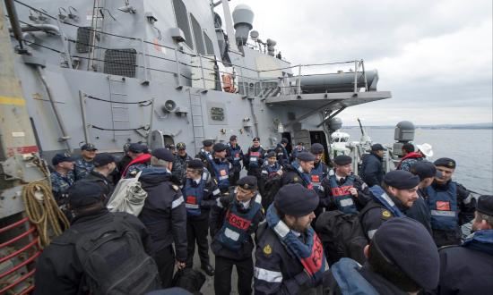 oyal Navy flag officer sea training instructors and U.S. Navy Afloat Training Group Sailors prepare to disembark the Arleigh Burke-class guided-missile destroyer USS Carney (DDG-64) in Plymouth, United Kingdom